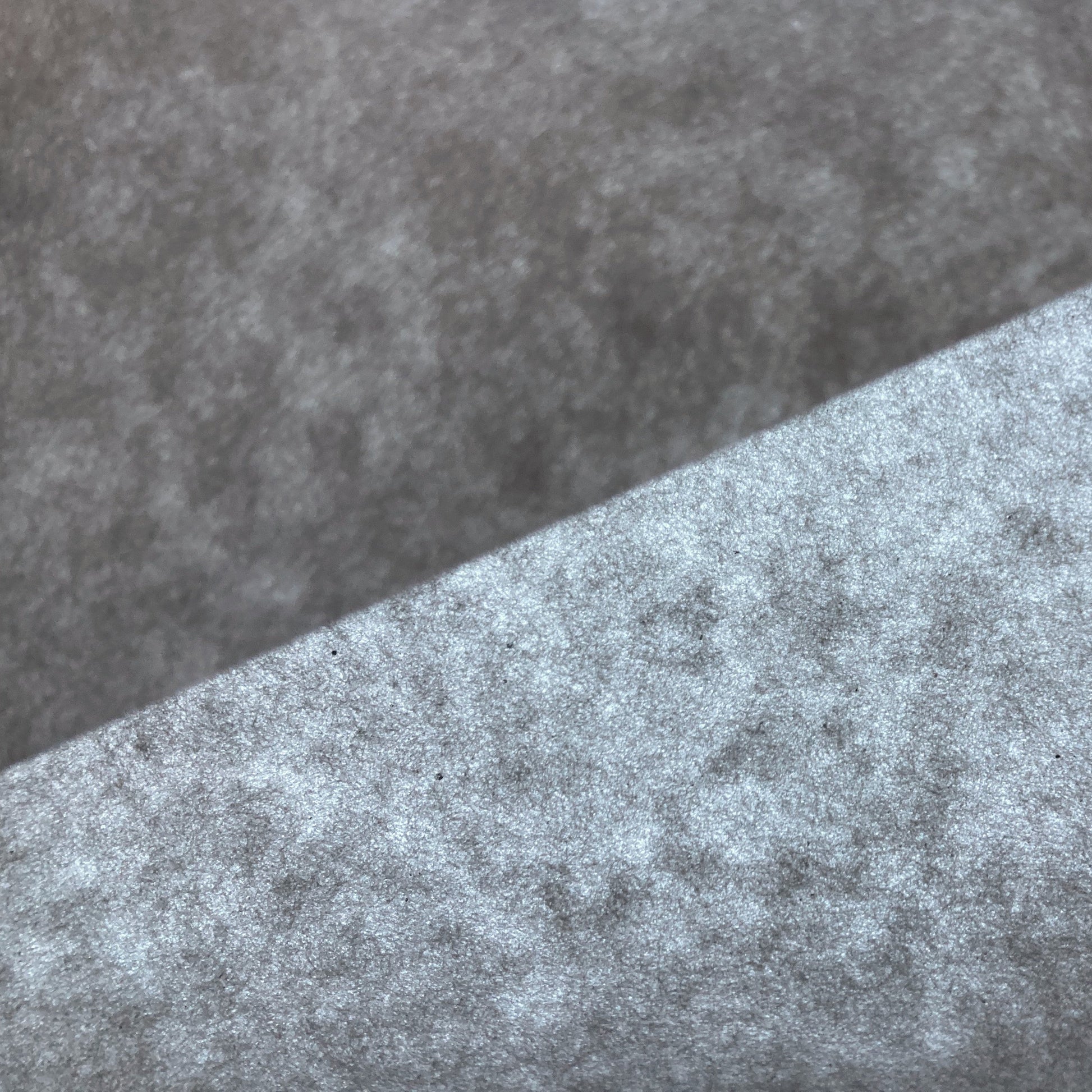 Close up of a sheet of Ogawa Origami paper, folded and held against the light to show transparency